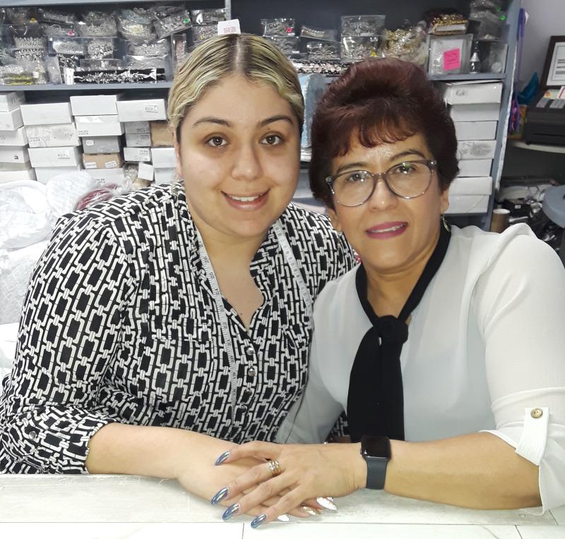 Susan Martinez, right, is the owner of Susan's Boutique in Georgetown. She and daughter Michelle sell and alter the dresses, and also offer men's formal wear for rent. JEFF SEEMANS PHOTOS
